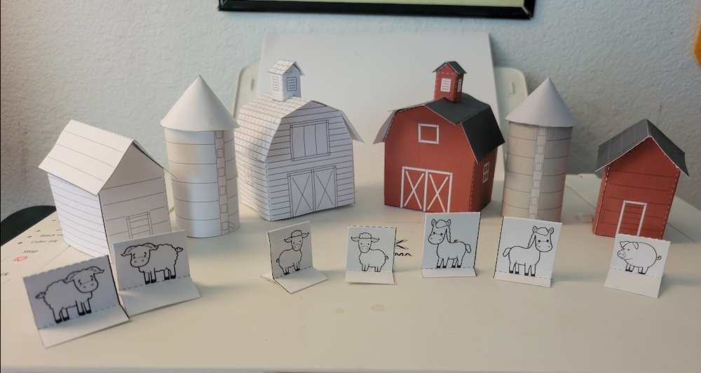Close view of the finished paper barns, silos and corn crib with the animals standing in front